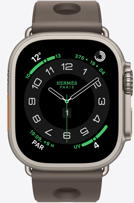 Apple Watch Hermès Ultra 3, boîtier en titane, naturel, cadran Hermès Circulaire, complications : météo, anneaux Activité, heure de Paris, index UV, coté droit, Digital Crown, micro, bouton latéral en saillie, bracelet Scub’H Diving, gris titane