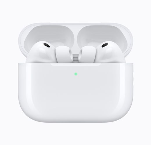 AirPods 4 inside an open white charging case