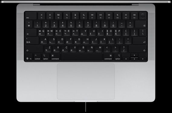 키보드와 그 아래의 Force Touch 트랙패드가 보이도록, MacBook Pro 14를 열어놓고 위에서 내려다본 모습