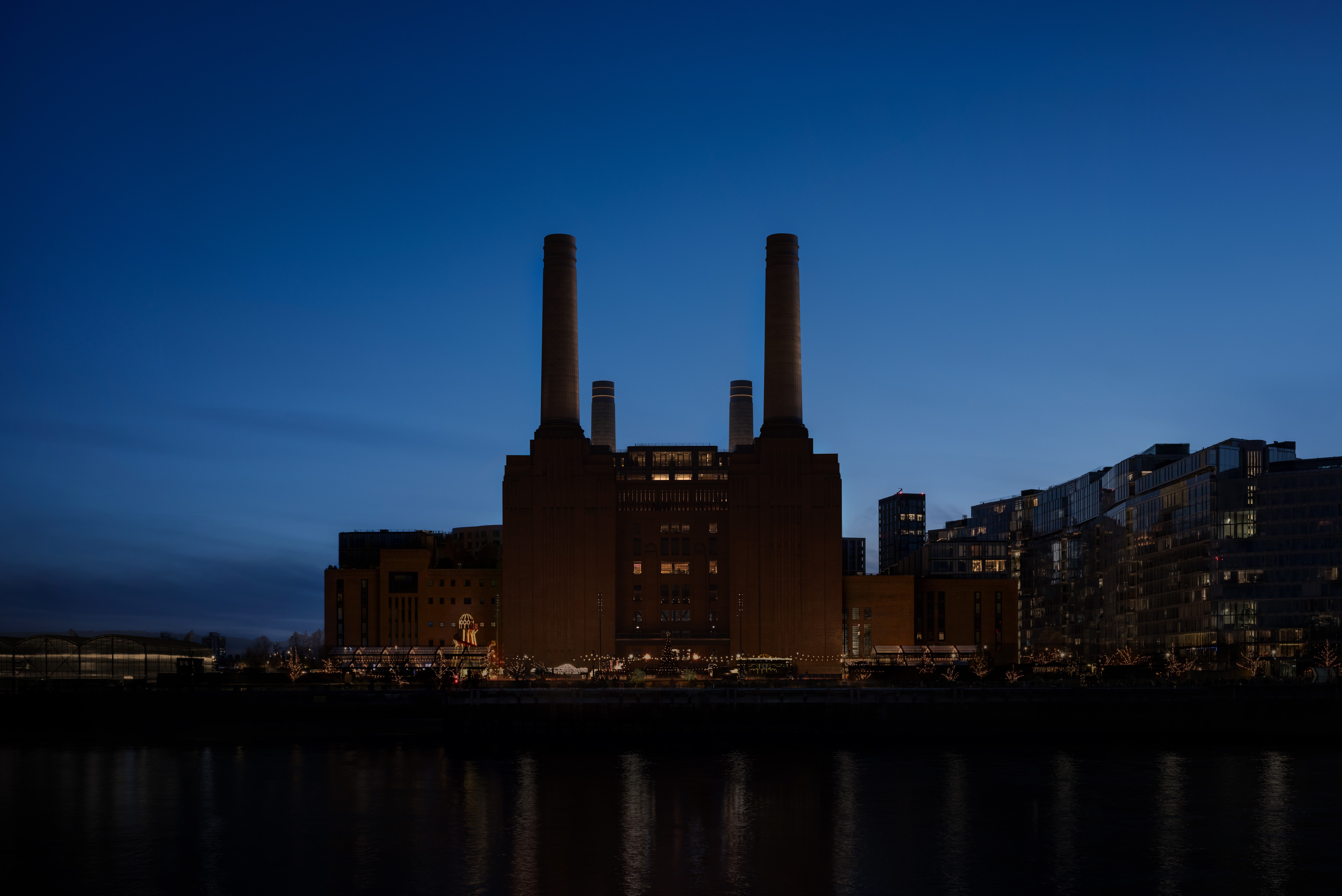 Magical Christmas tree projections on the riverside towers of iconic Battersea Power Station